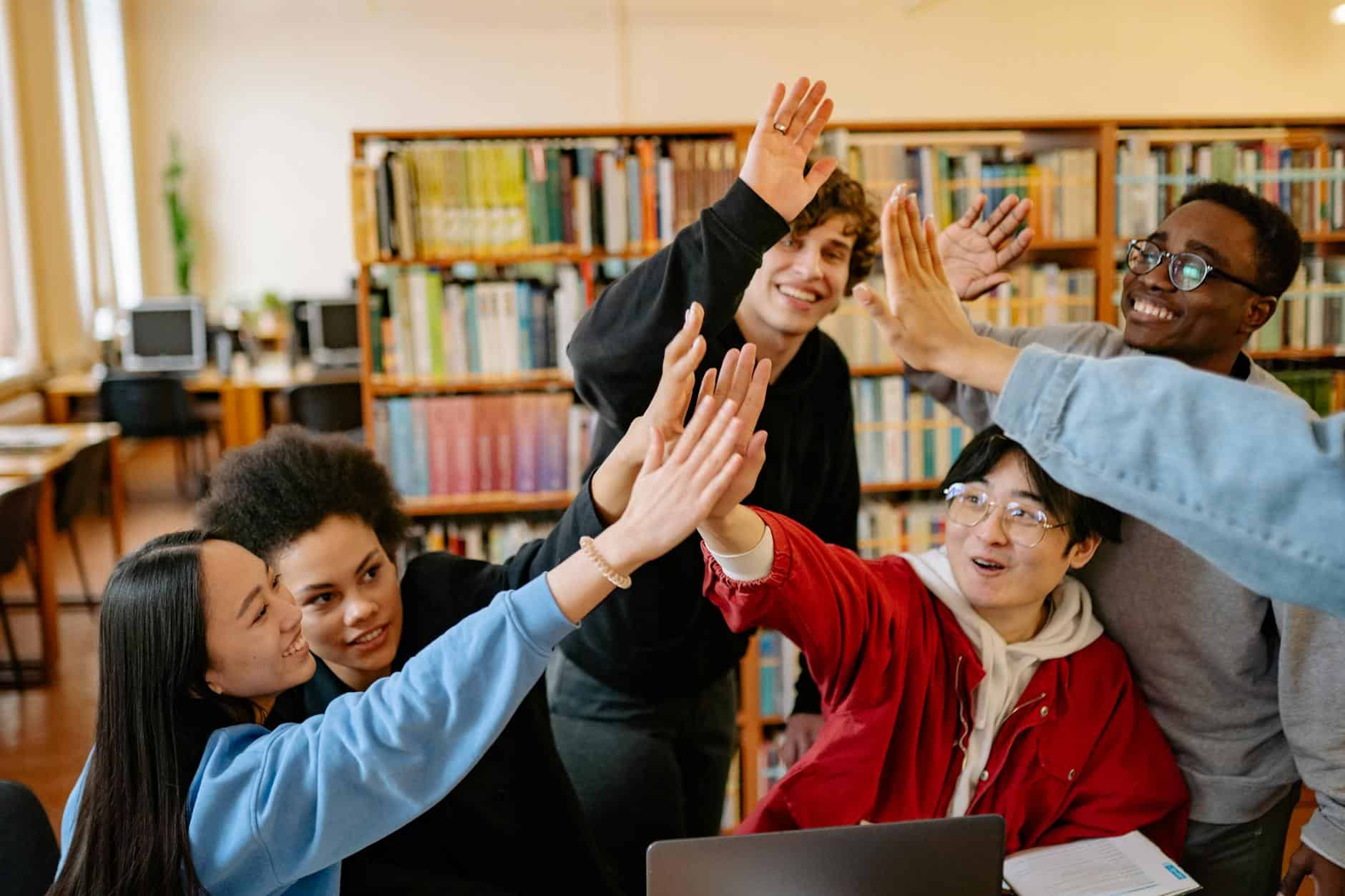 Livonia Public Library| image: teens-collaborating-library-study